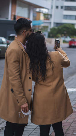 Couple of empresses walking in the city with elegant suits and happyの写真素材