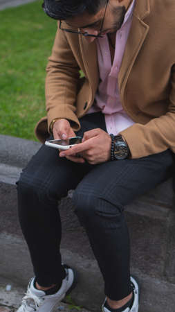 Young business man walking through the cityの写真素材