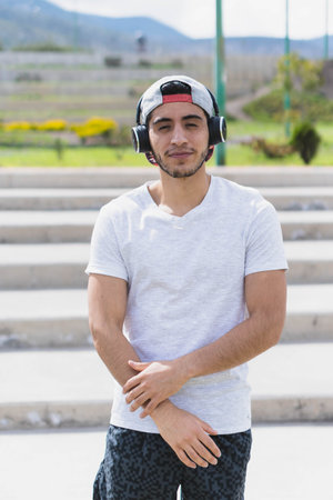Young man listening to music to perform different exercises and get inspired.の写真素材