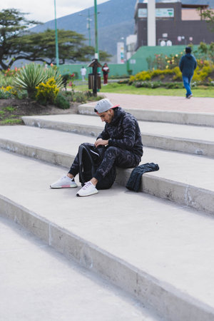Young man listening to music to perform different exercises and get inspired.の写真素材