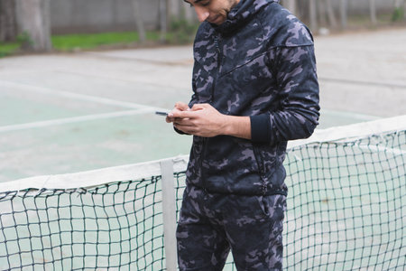 Young man listening to music to perform different exercises and get inspired.