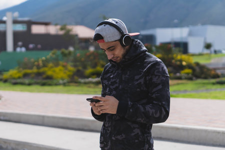 Young man doing different warm-up and cardio exercises in the park.の写真素材