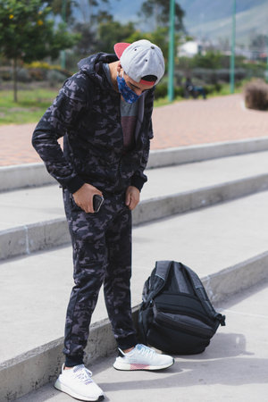 Young man doing different warm-up and cardio exercises in the park.の写真素材