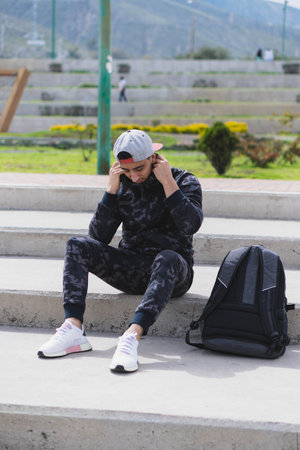 Young man doing different warm-up and cardio exercises in the park.の写真素材