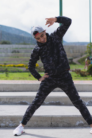 Young man doing different warm-up and cardio exercises in the park.の写真素材