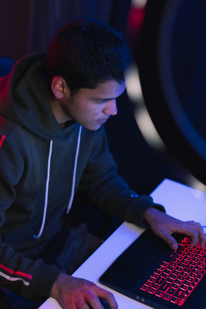 Young man doing a live video game sharing online. On different streaming platforms.の写真素材
