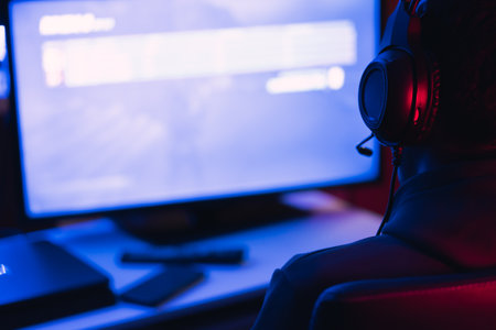 Young man doing a live video game sharing online. On different streaming platforms.の写真素材