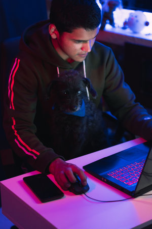 Young man doing a live video game sharing online. On different streaming platforms.の写真素材