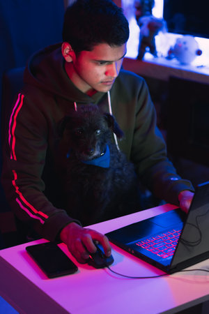 Young man doing a live video game sharing online. On different streaming platforms.の写真素材