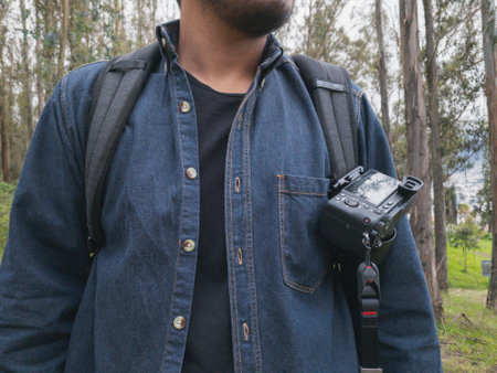 Young man walking in the woods taking selfies. To show your friends.の写真素材