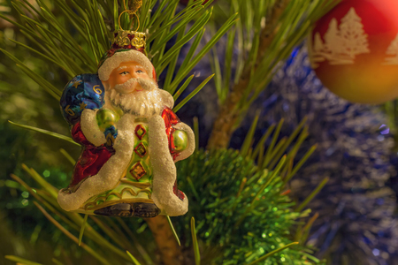 beautiful small santa clause and garland on christmas tree .Closeの写真素材