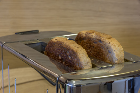 Toaster with toasted bread , Kitchen equipment. Close up.