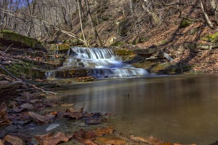 Beauty waterfall in river in the mountainの写真素材