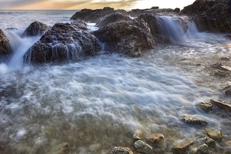 beauty close up flowing seawater over the rocks