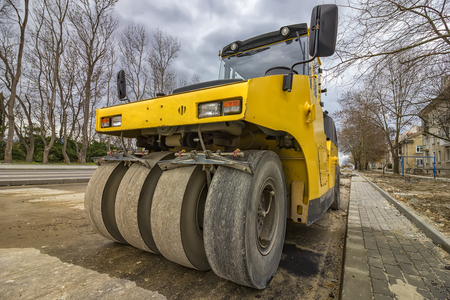 Close view on the road roller. Street paving works