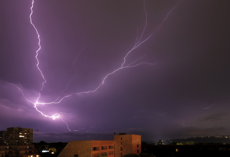 beautiful powerful lightning strikes over the sea and city, Varna. Bulgaria