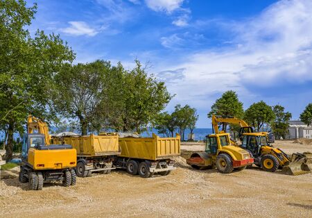 day view of stopped industry vehicles at the construction siteの写真素材
