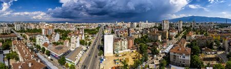 Amazing aerial panorama from a drone of city Sofia with stormy clouds, Bulgariaの写真素材