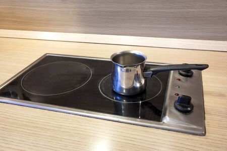 the empty pot for coffee or tea on the stoveの写真素材