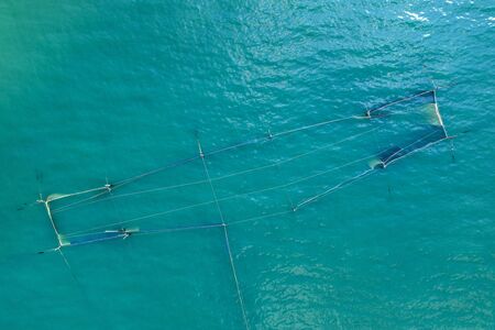 aerial view from drone of fishing net in the sea