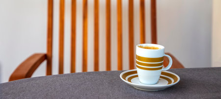 Banner with coffee cup on the table and chair. Conceptの写真素材