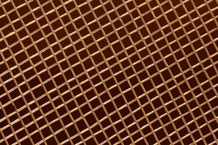 grid with a pattern of numerous small shaped cells on dark background, close view