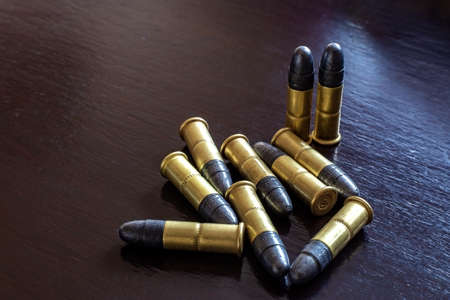Bullets on the table. Ammunition. Concept of crimeの写真素材