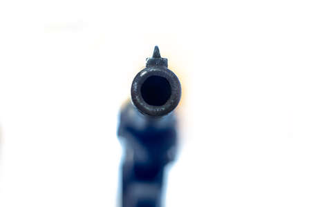 aimed barrel of a pistol, isolated on white backgroundの写真素材