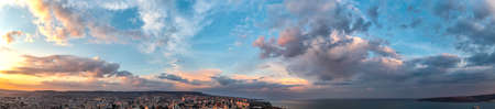Panoramic view of amazing sunset sky over the cityの写真素材