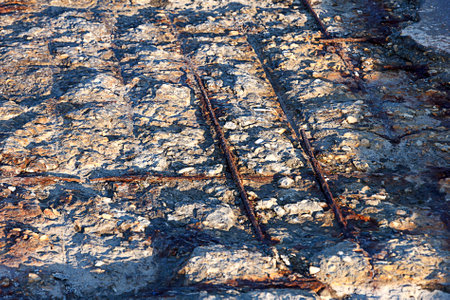Old cracked concrete with rusty metal. Close upの写真素材