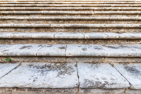 Close-up of old stone steps of the stairs.の写真素材