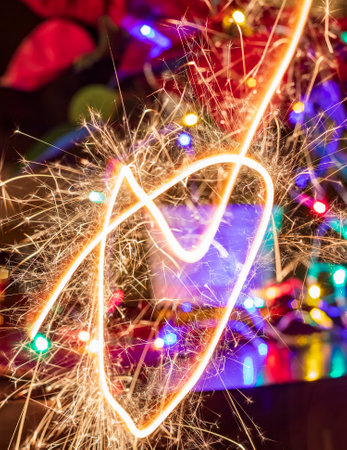 Background of glowing traces of sparklers. New year or holiday conceptの写真素材