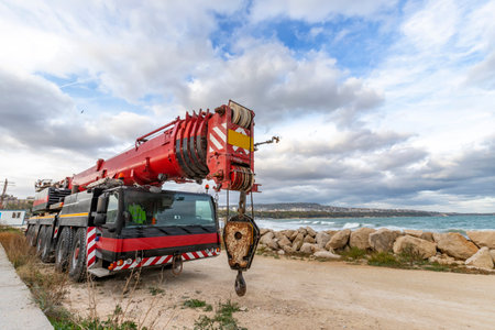 Heavy duty mobile crane parked near the sea. Telescopic truck mounted craneの写真素材