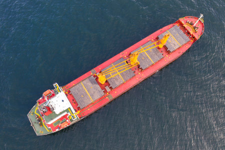 Aerial top view of cargo ship vessel import export sailing.の写真素材