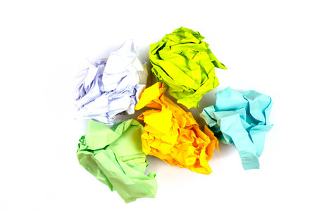 Crumpled and torn color paper isolated on whiteの写真素材