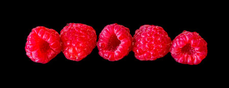 set of raspberry in line, isolated on black background.の写真素材