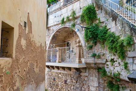 Attractive balcony in a stone house in the Ragusa Ibla city in Sicily, Italyの写真素材