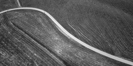 Abstract aerial view of road in the field. Black and whiteの写真素材