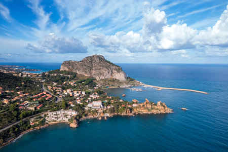Aerial view of a bay and big rock near Cefalu, Sicily, Italy.の写真素材
