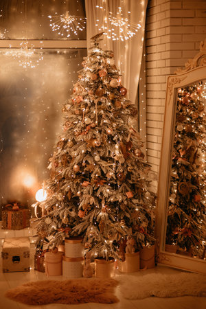 Beautiful New Year's holiday tree, in scenery, with gifts underneath, in room near large mirror, against background of window. winter holidays composition.の写真素材