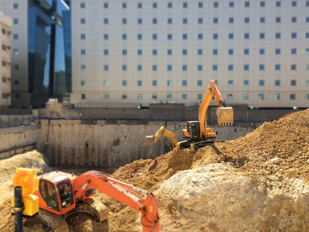 Machines at construction site excavatingの写真素材