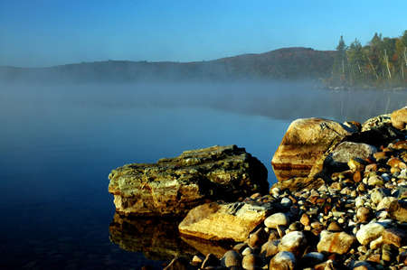 Rocky shoreline on a lake in Ontario at sunriseの写真素材