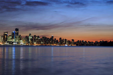 Vancouver skyline in the evening sunset across Burrard Inletの写真素材