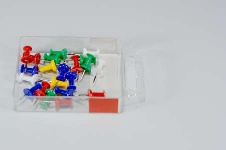 green, red, blue, white, yellow, the calls are placed in a transparent boxの写真素材