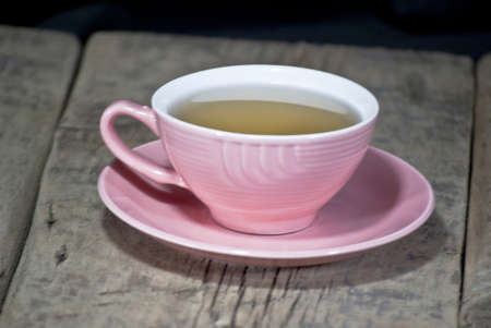 a Cup of tea filled with a rosette in a beautiful Crystal glassの写真素材