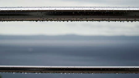 Drops of water after rain on metal pipes.の写真素材
