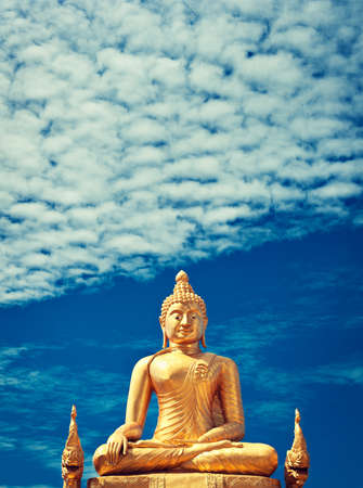Golden Buddha statue of Big Buddha over blue sky Phuket