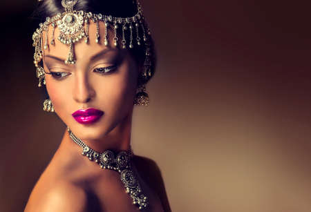 Beautiful Indian women portrait with jewelry. elegant Indian girl looking to the side, bollywood...
