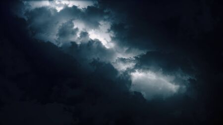 Epic thunderstorm clouds at night with lightning. Realistic black storm sky timelapse with powerful flashes and lights. Force of nature and dark environment 3D illustration. Severe weather backgroundの写真素材
