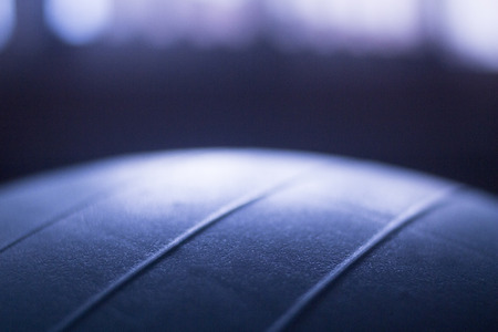 Blue pilates gym aerobics exercise ball in gymnasiumの写真素材